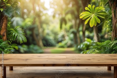 Wooden table top on blurred tropical garden background - can be used for display or montage your product