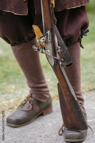 Old musket held by a soldier