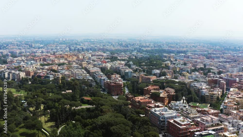 Aerial: Lush Trees Near Buildings In City Against Sky On Sunny Day - Rome, Italy Aerial: Lush Trees Near Buildings In City Against Sky On Sunny Day - Rome, Italy