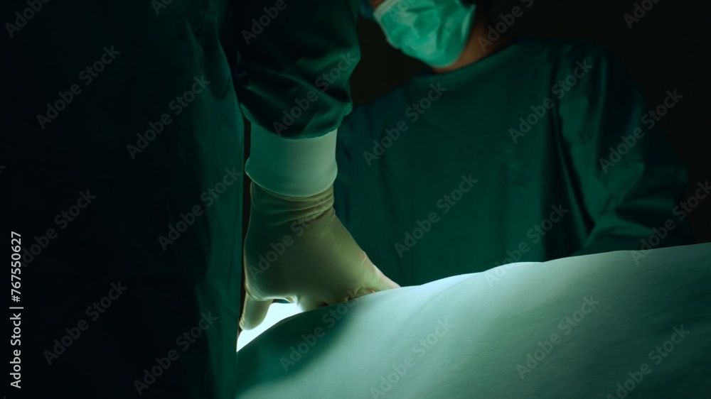 Group of team doctor and surgeon doing surgery with patient in the operation at hospital, medical and emergency, specialist and assistant rescue patient with expertise, surgical and health. Group of team doctor and surgeon doing surgery with patient in the operation at hospital, medical and emergency, specialist and assistant rescue patient with expertise, surgical and health.