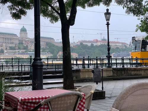 street cafe and tram in budapest on the banks of the danube