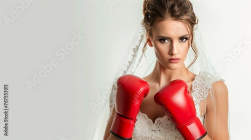 Bride wearing wedding dress and red boxing gloves isolated on white background, concept of marriage is a war, complicated human relationships.