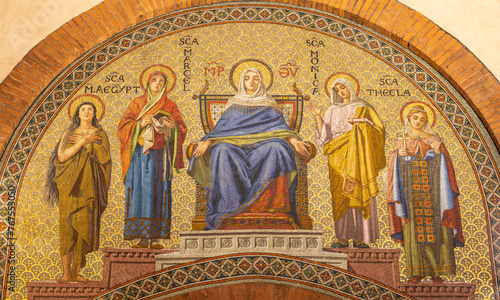 MILAN, ITALY - MARCH 6, 2024: The mosaic of Virgin Mary among the saints in the church Basilica di San Babila by  workroom Murano-Venezia (1929).