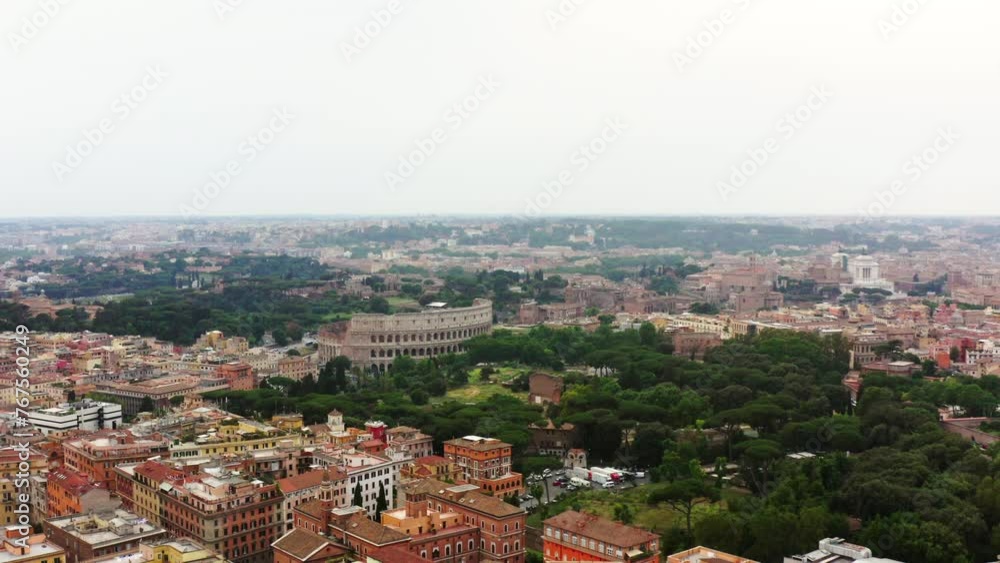 Aerial: Colosseum Amidst Buildings And Trees In City Against Sky - Rome, Italy Aerial: Colosseum Amidst Buildings And Trees In City Against Sky - Rome, Italy