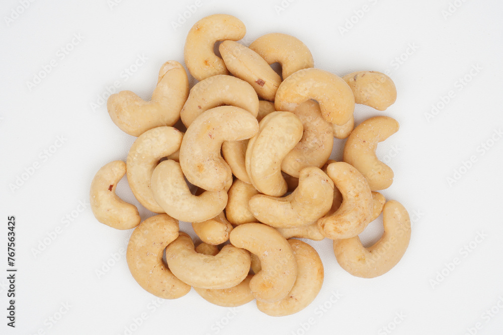 Heap of delicious cashew nuts isolated background Heap of delicious cashew nuts isolated background