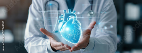 doctor holding a blue heart model photo