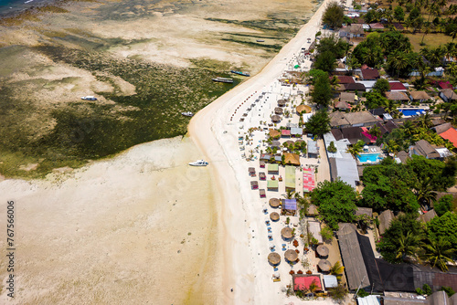 Aerial view of small tourist resorts and sunshades on a tropical island (Gili Air, Lombok, Indonesia) © whitcomberd