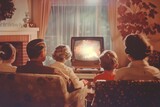Old vintage photo of a family watching TV at home