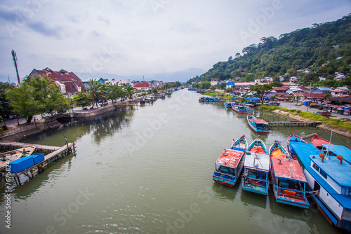 View of the Batang Arau River seen from the top of the Siti Nurbaya Bridge in Padang City, West Sumatra, Indonesia. The Siti Nurbaya Bridge is a famous bridge in Padang and a tourist destination.