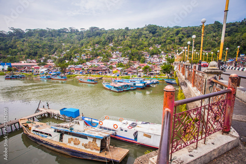 View of the Batang Arau River seen from the top of the Siti Nurbaya Bridge in Padang City, West Sumatra, Indonesia. The Siti Nurbaya Bridge is a famous bridge in Padang and a tourist destination.