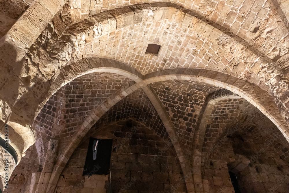 Stone arched vault in the dining room at the Templar fortress in the Acre old city in northern Israel