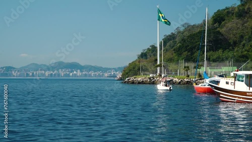 The Brazilian Flag waves at Urca's Beach in Rio de Janeiro, Brazil photo