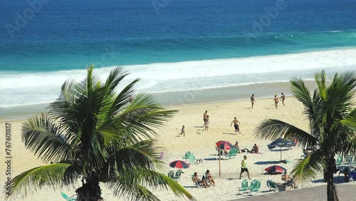Unidentified people have fun at Sao Conrado beach in Rio de Janeiro, Brazil. photo