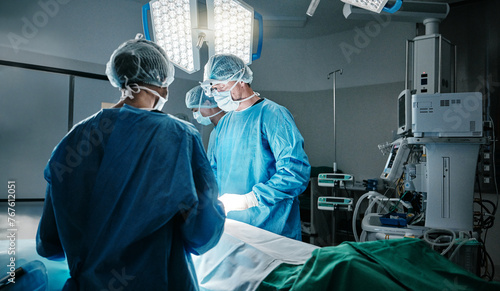 Surgery, light or surgeons with teamwork for emergency, accident or healthcare in hospital clinic. ICU, medical operation or doctors in surgical collaboration in operating room to support or help