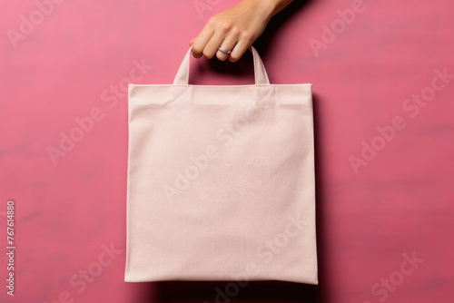Hand Holding a Blank Pink Tote Bag