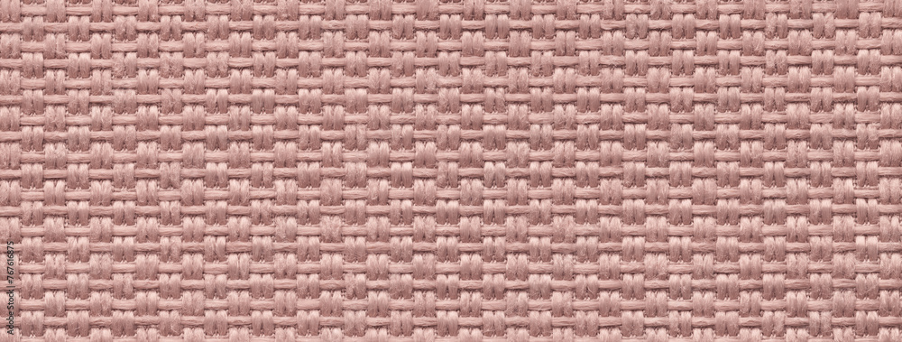 Fototapeta premium Texture of pink background from woven textile material, macro. Structure of vintage rose fabric cloth