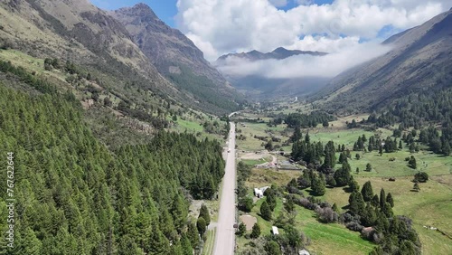 Drone Flight Over El Cajas National Park: Cloudy Day Aerial Panorama of Azuay's Mountainous Terrain and Winding Roads in Cuenca, Ecuador. photo