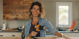 A woman with a cheerful smile engages in a DIY home project, confidently using a drill on a wooden piece.