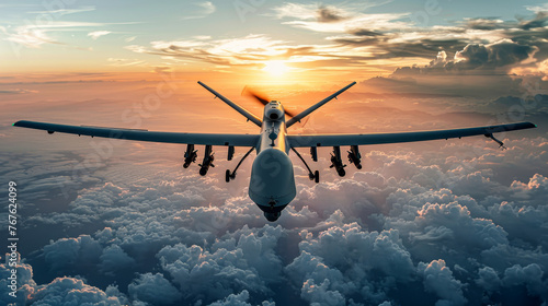 A military unmanned aerial vehicle UAV patrols flying over the clouds