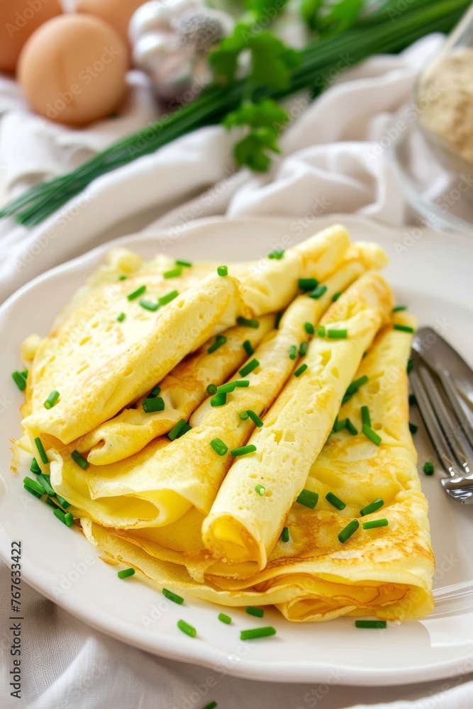 A plate of yellow omelets with parsley on top A plate of yellow omelets with parsley on top