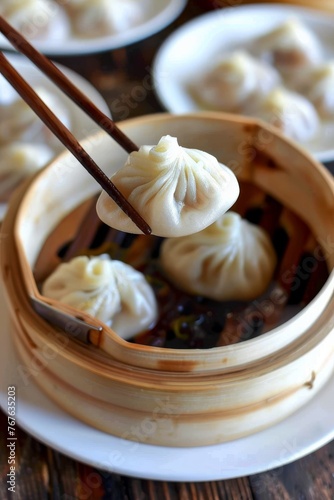 A plate of dumplings with a spoon in front of them