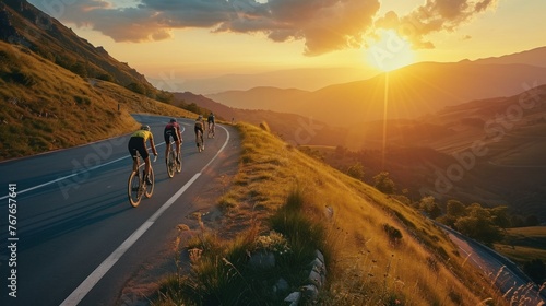 Group of cyclist ride together on road bicycles in beautiful nature. Sunset light, sea in background © Ruslan Gilmanshin