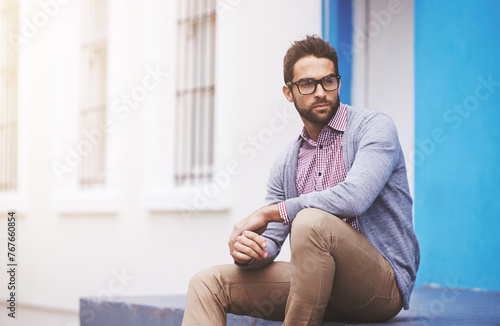 Man, fashion and confident in city with glasses, black frame for style with chic outfit and pride. Urban, unique and trendy designer clothes, spectacles for accessory and apparel with model outdoor