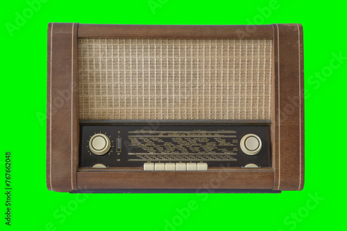 Authentic 50-60s radio receiver. Vintage. Isolated on green background.