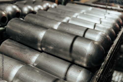 stacked metal cylinders in industrial factory