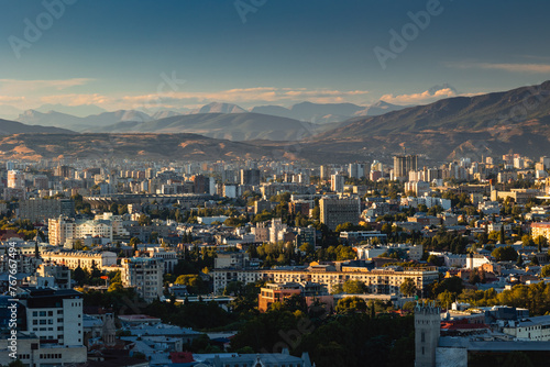 View of Tbilisi from the surrounding hills. In the background you can see the Caucasus Mountains. A warm autumn day in the capital of Georgia.