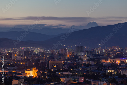View of Tbilisi from the surrounding hills. In the background you can see the Caucasus Mountains. A warm autumn day in the capital of Georgia. © PawelUchorczak