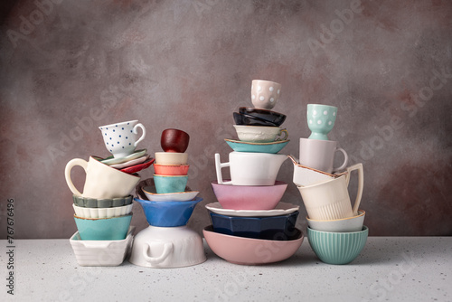 Stack of Varied Tableware and Teacups photo