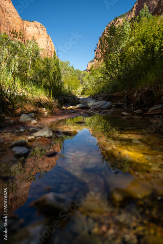 Lush green valley with river winds through Kolob Canyons photo