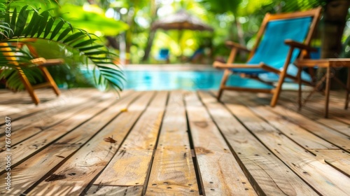 Wooden Pool Deck in Tropical Resort Setting © red_orange_stock