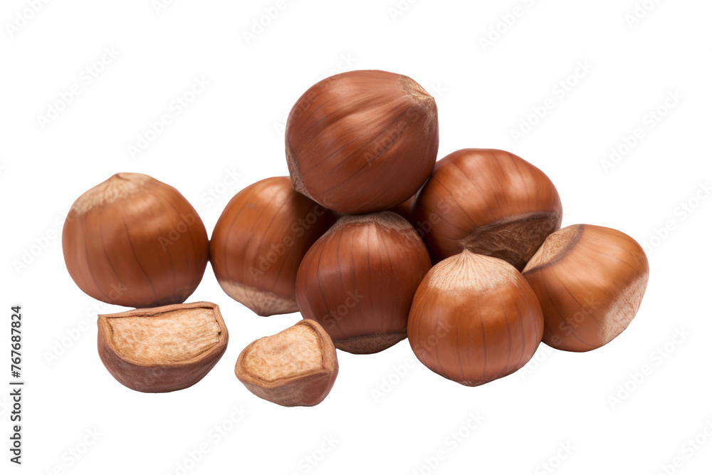 Obraz premium Full and halfs of hazelnuts on white background. Isolated