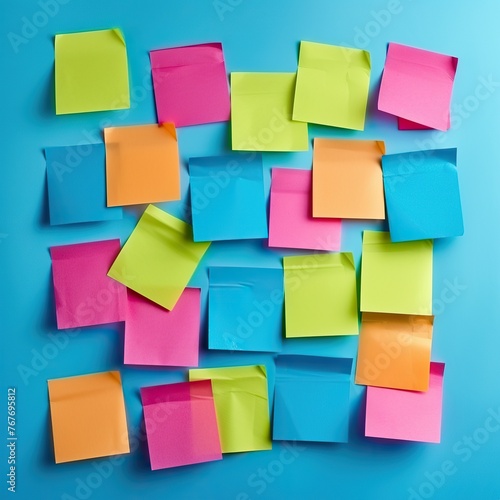 A colorful wall of sticky notes with different colors and shapes. The wall is full of notes and it looks like a brainstorming session