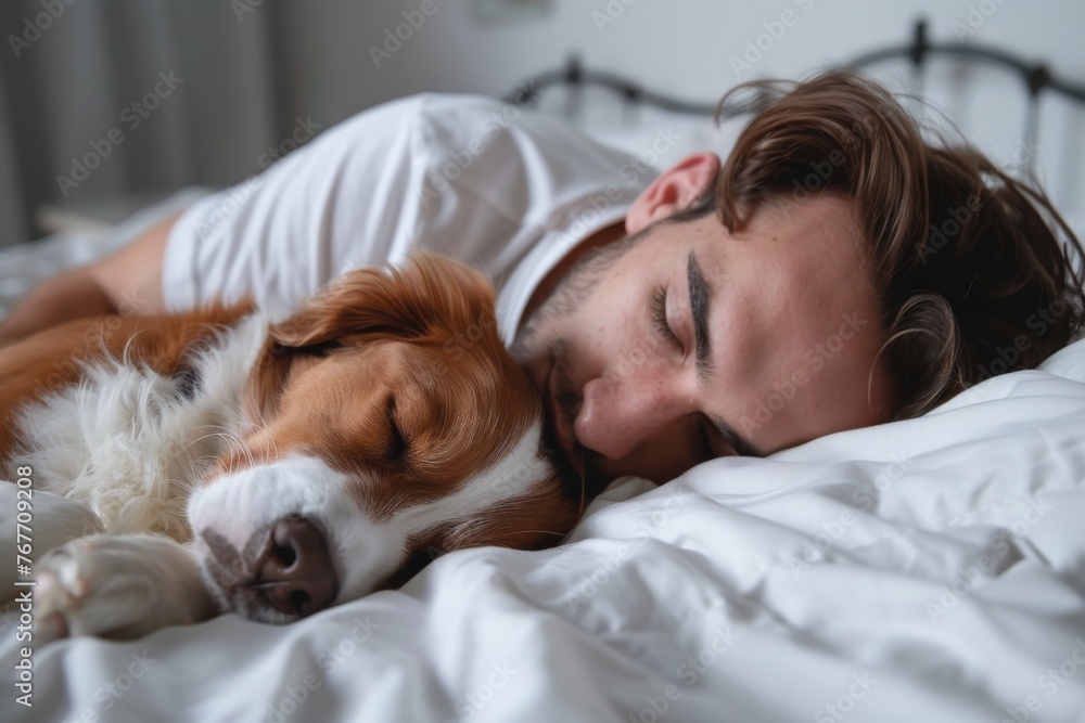 A man is sleeping with his dog on a bed A man is sleeping with his dog on a bed
