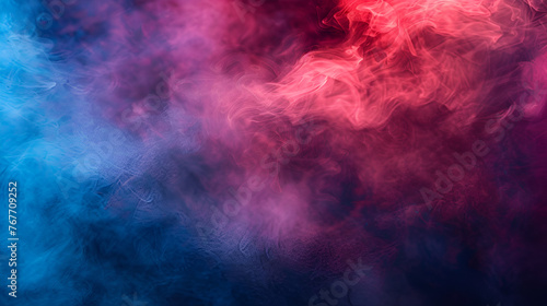 Clouds of isolated colored smoke: blue, red, orange, pink; scrolling on a black background in the dark close up ,smoke under the lights on a colorful background photo