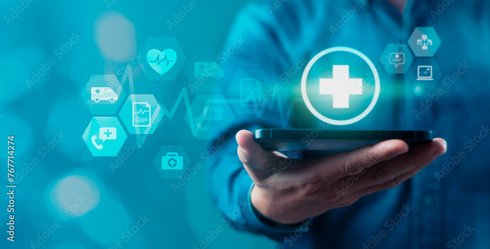 A person is holding a mobile phone with a blue screen that has a health sign A person is holding a mobile phone with a blue screen that has a health sign