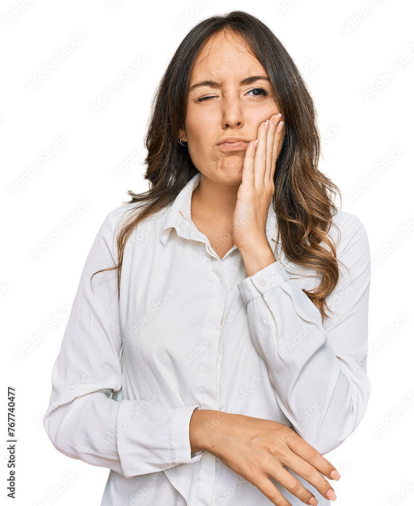 Young brunette woman wearing casual clothes touching mouth with hand with painful expression because of toothache or dental illness on teeth. dentist Young brunette woman wearing casual clothes touching mouth with hand with painful expression because of toothache or dental illness on teeth. dentist