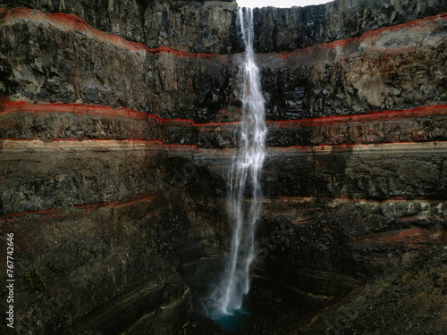 Hengifoss in Iceland waterfall on coloured stonewall  photo