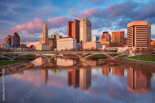 Columbus, Ohio, USA. Cityscape image of Columbus, Ohio, USA downtown skyline with the reflection of the city in the Scioto River at spring sunset. photo