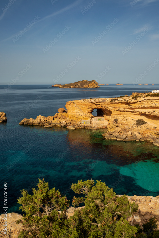 The most beautiful hidden cove with turquoise water and caves near Cala Comte beach, Sant Josep de Sa Talaia, Ibiza, Balearic Islands, Spain