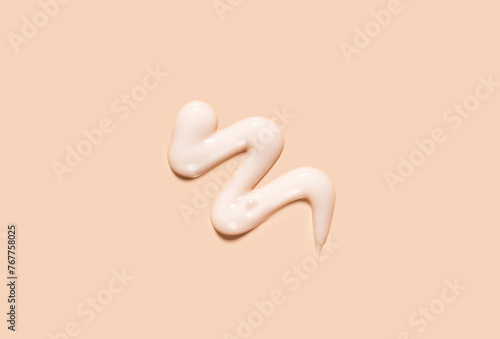 Carta da parati cosmetic smear of creamy texture on a beige background