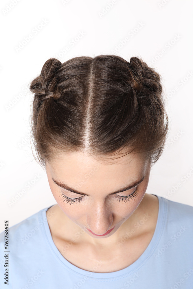 Woman with braided hair on white background