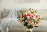 Beautiful bouquet of fresh flowers in vase indoors, space for text