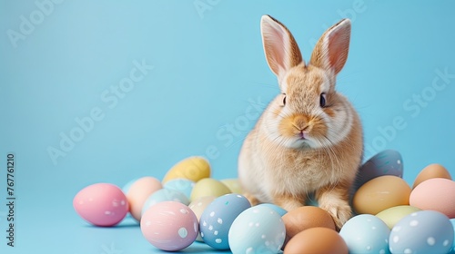 Easter Bunny surrounded by colorful Easter eggs in a fluffy  white fur Cute rabbit with eggs  isolated on a farm Easter Bunny surrounded by colorful Easter eggs in a fluffy  white fur Cute rabbit