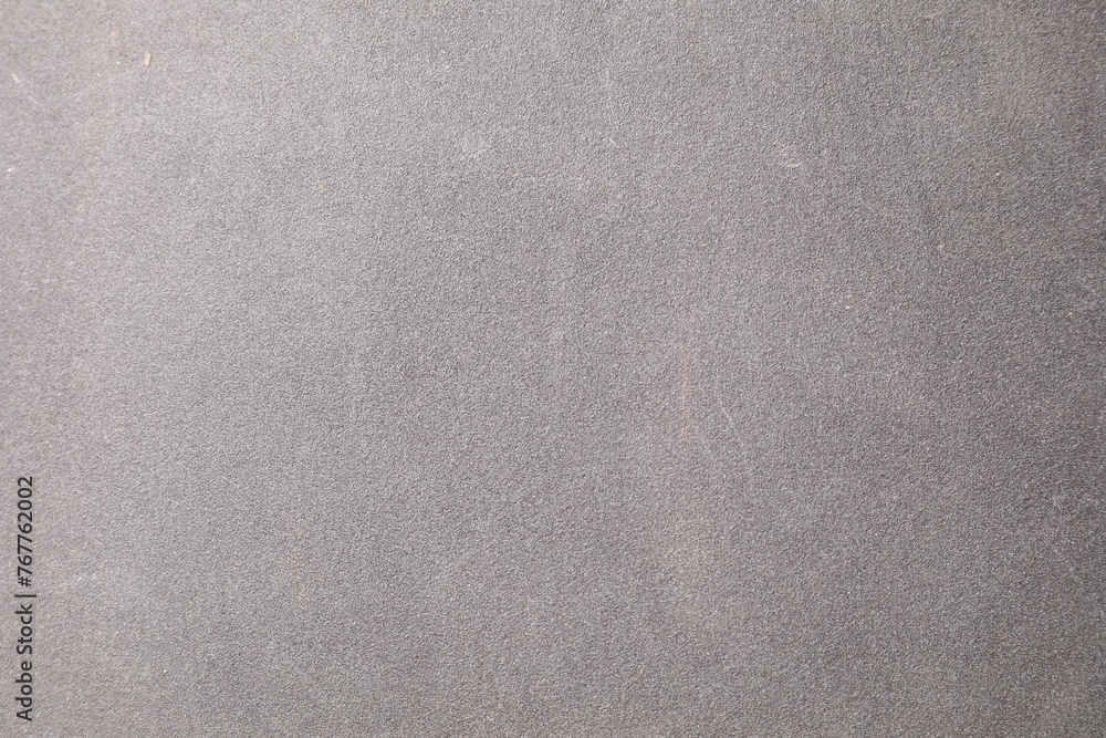 Fototapeta premium Texture of coarse sandpaper as background, top view