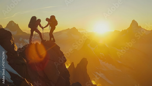 A photo of two hikers helping each other reach the top, with breathtaking mountain scenery in front of and behind them during sunrise. Concept of teamwork and collaboration in outdoor adventure. 