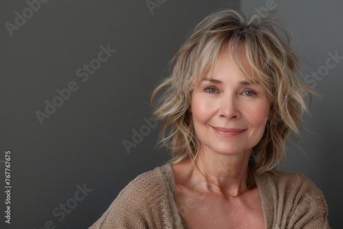 studio portrait of stylish middle age smiling 50 - 55 year old woman posing on grey background, Generative AI